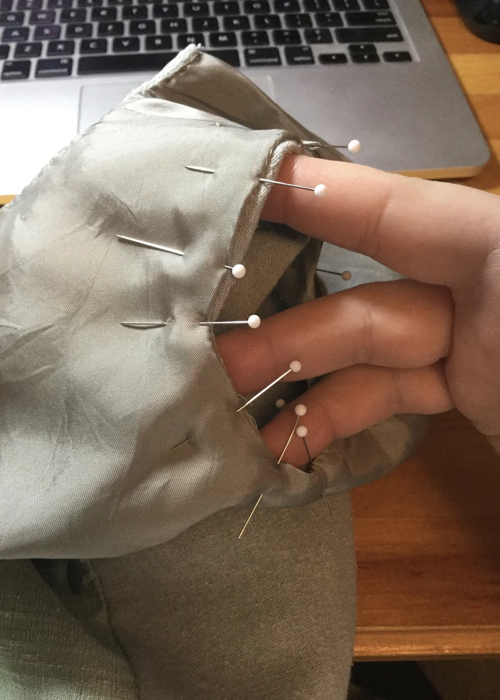 Pinning the lining to the right armhole.