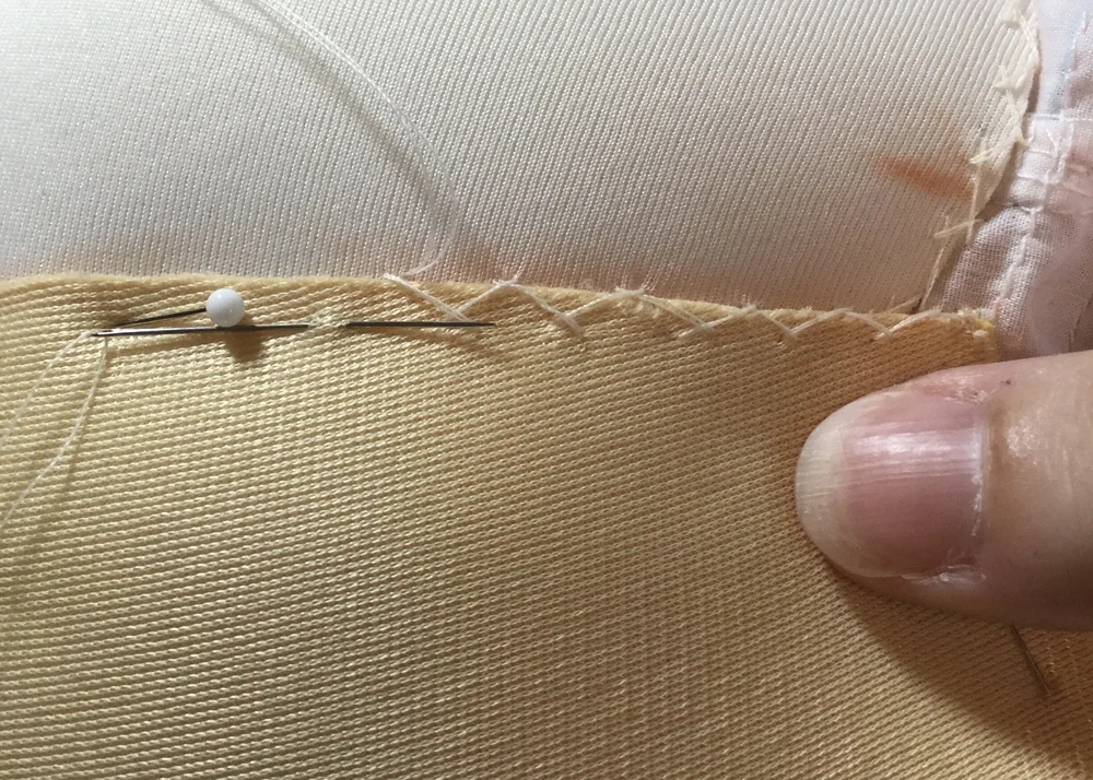 Stitching the padding to the block.