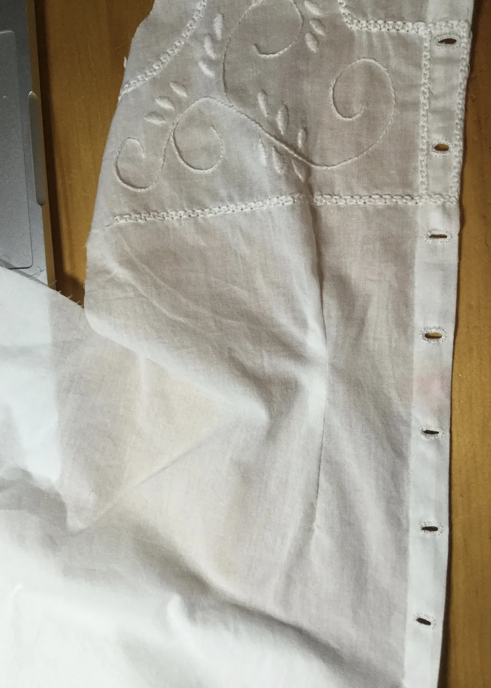 Buttonholes.