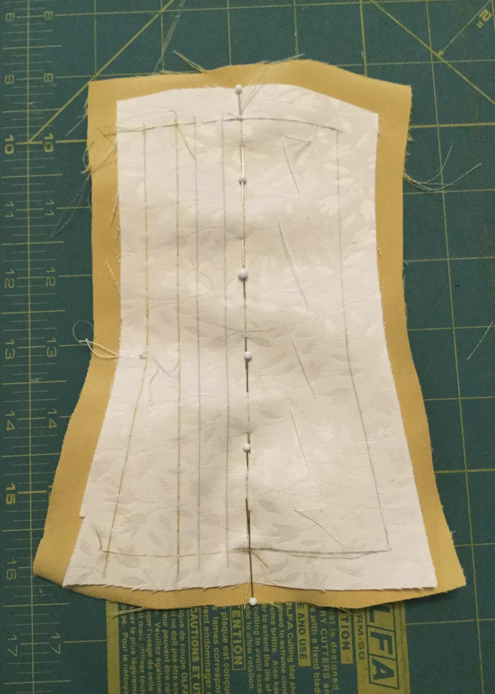 Pinning the facing in place.