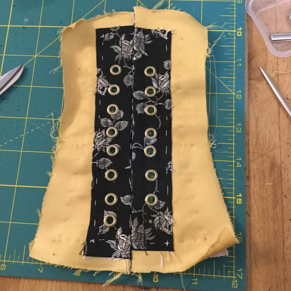 Almost all the eyelets are in place.