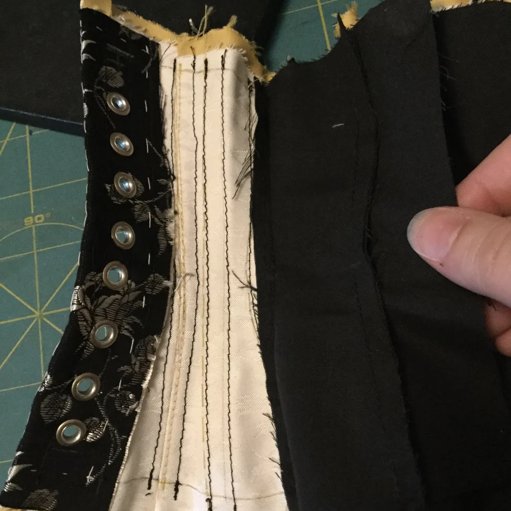 Securing the lining at the seams.