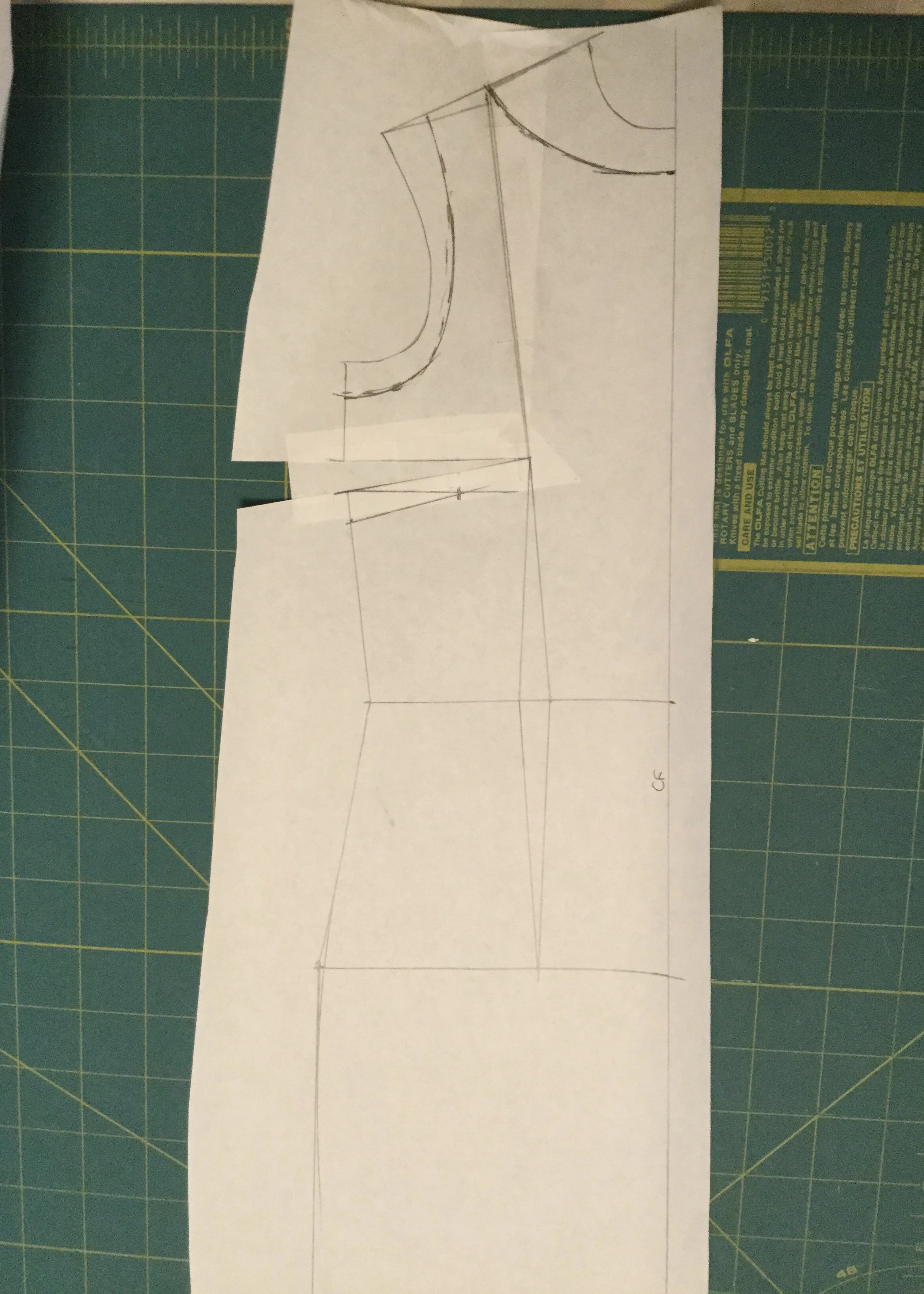 Redrawing the armholes and neckline.