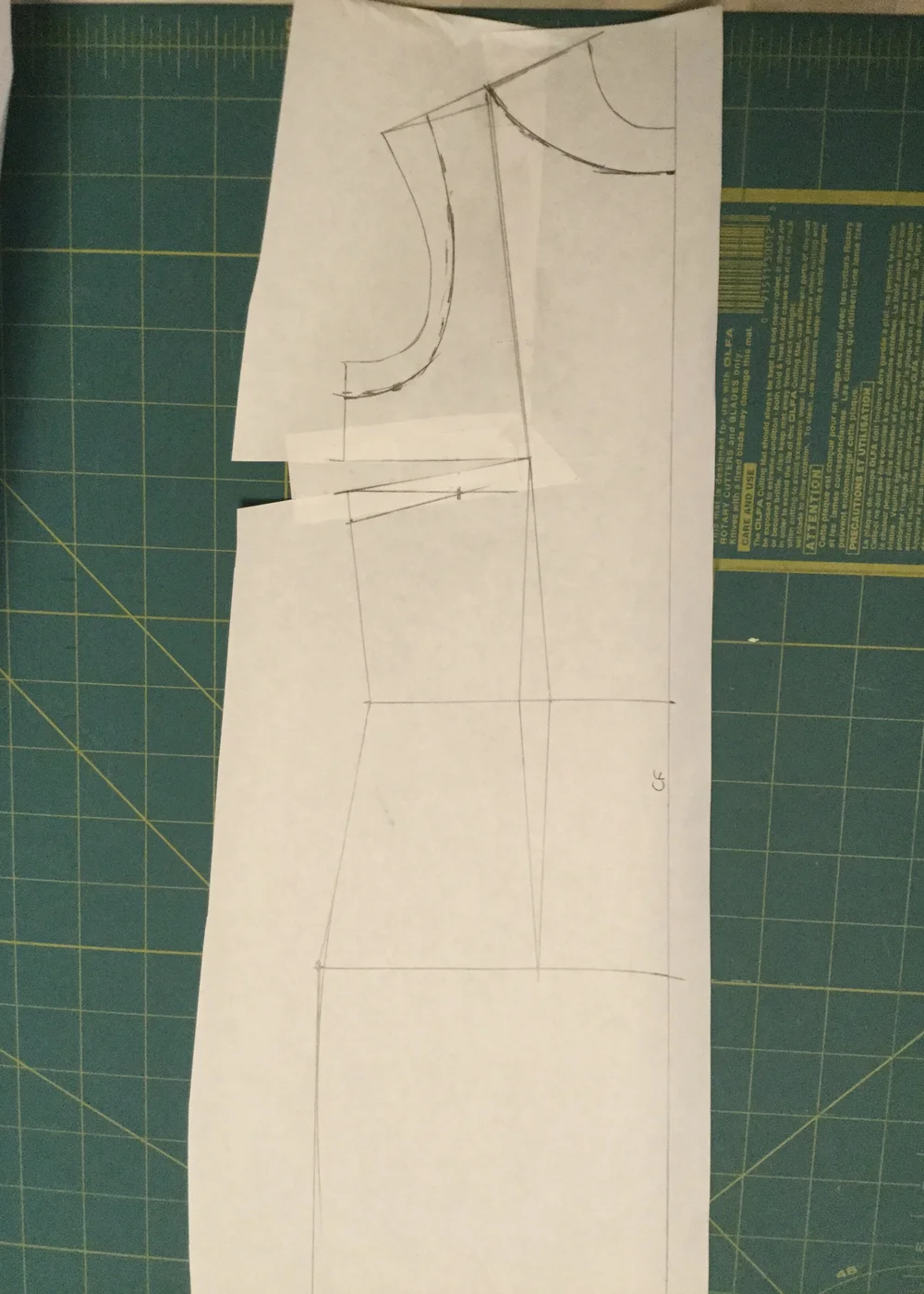 Redrawing the armholes and neckline.