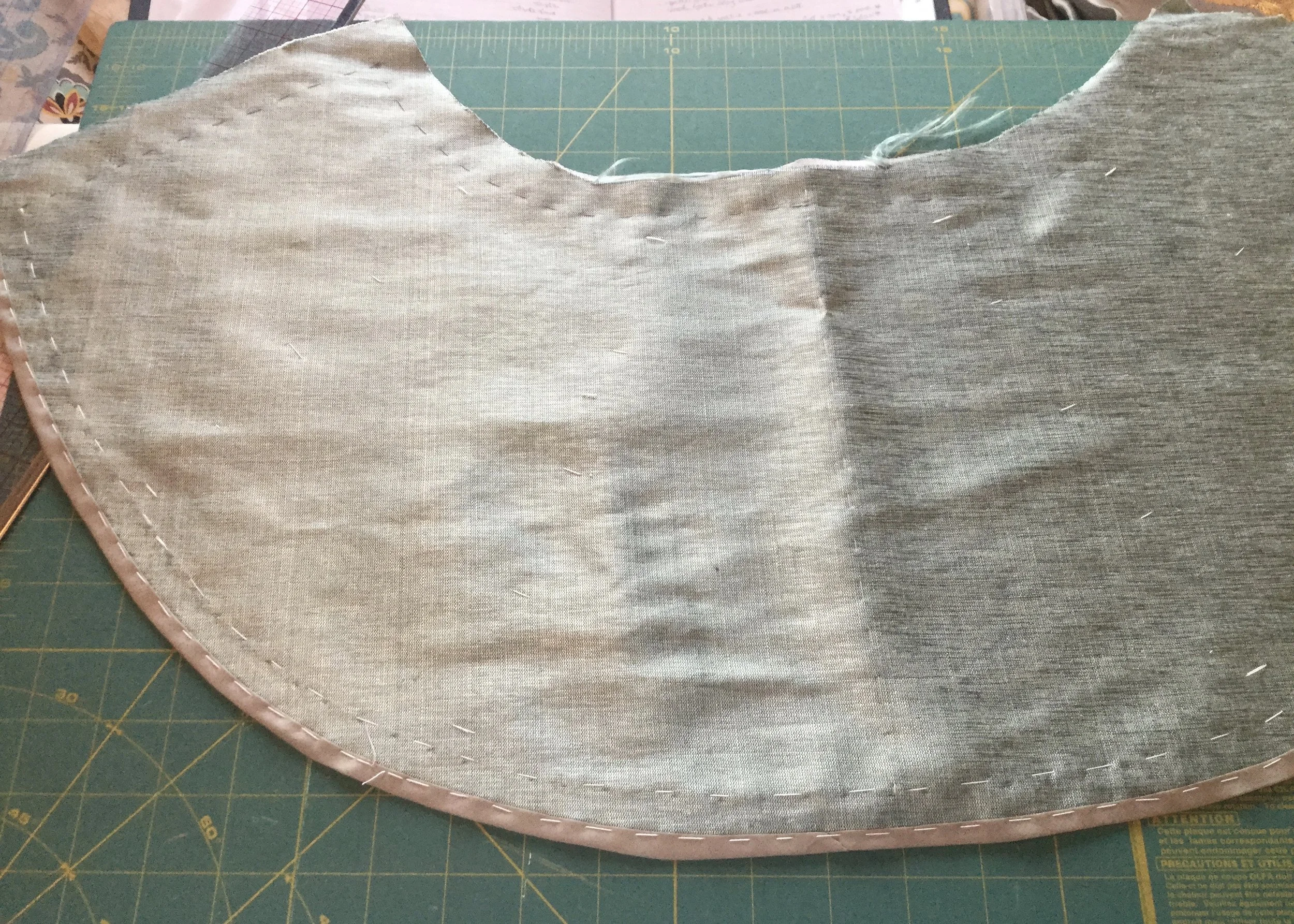 Binding the hem.