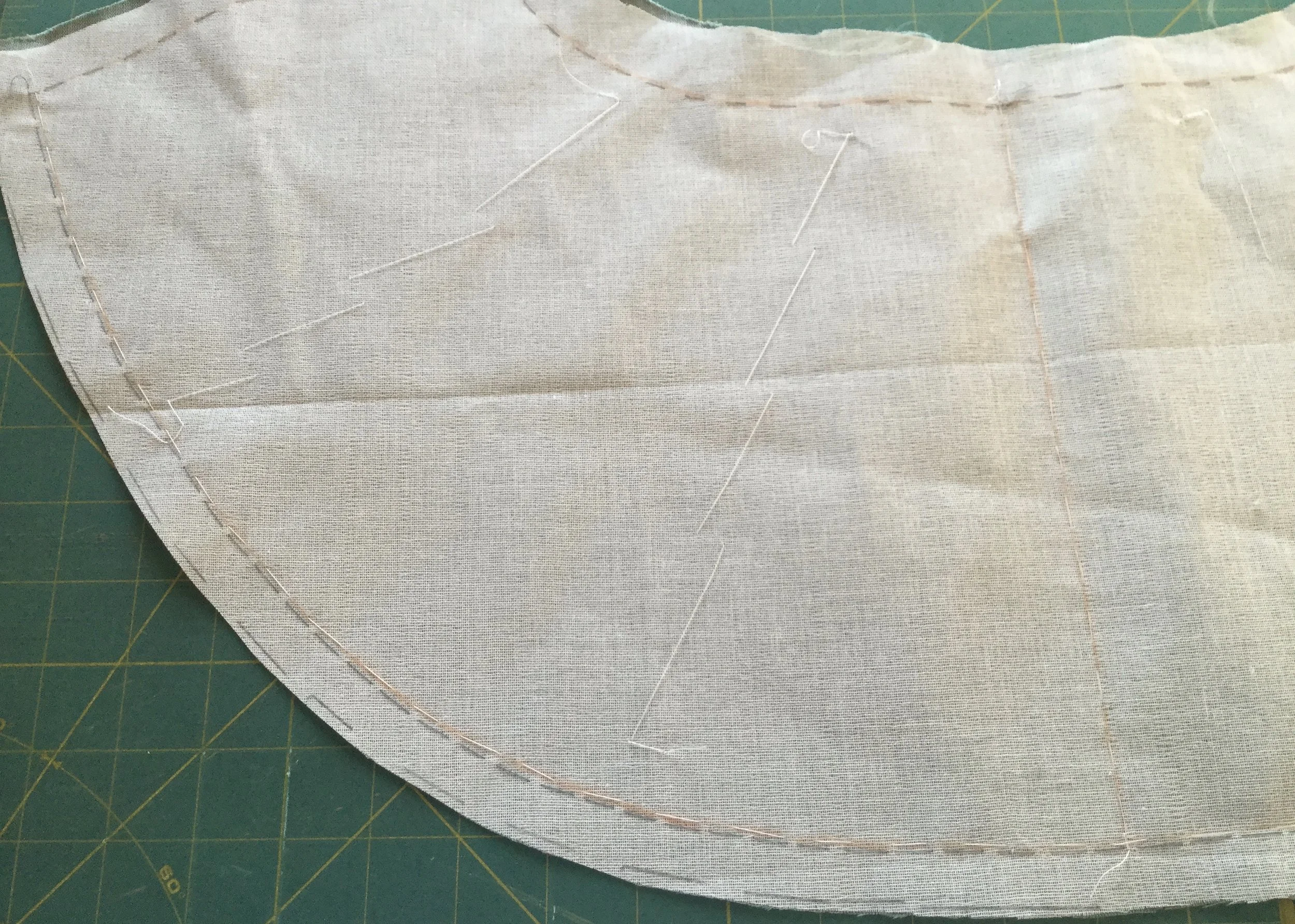 Flat mounting the backing to the fabric.