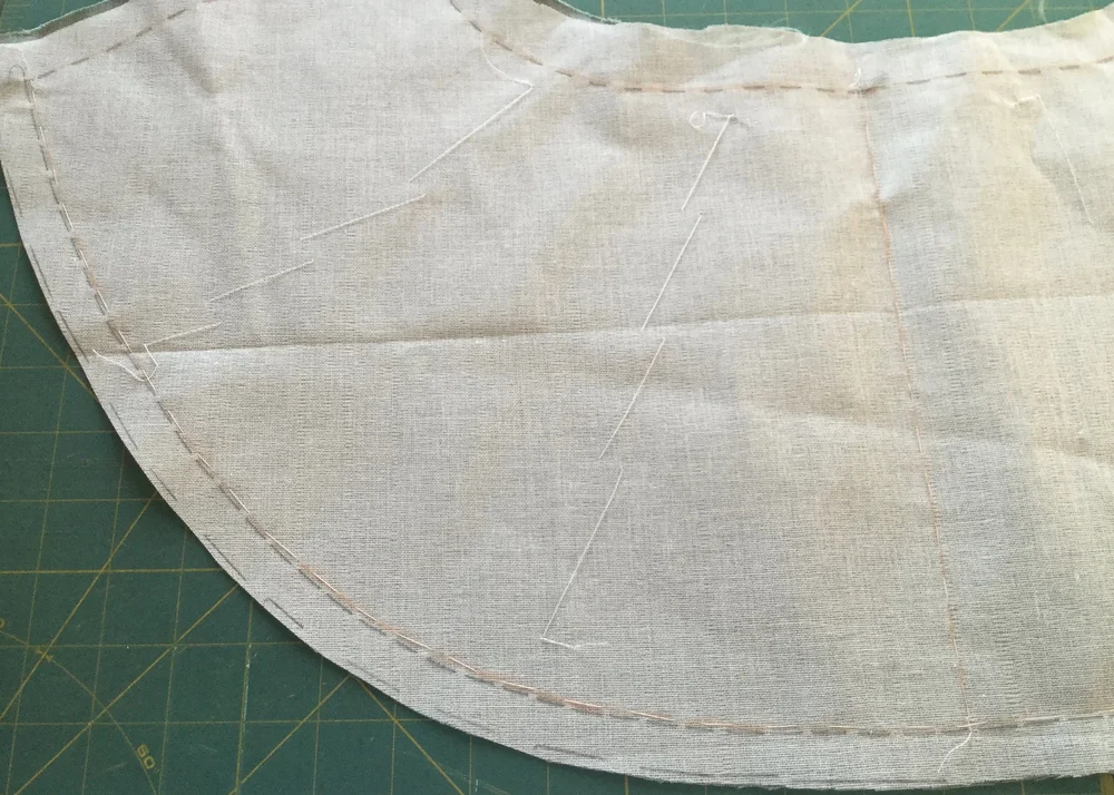 Flat mounting the backing to the fabric.