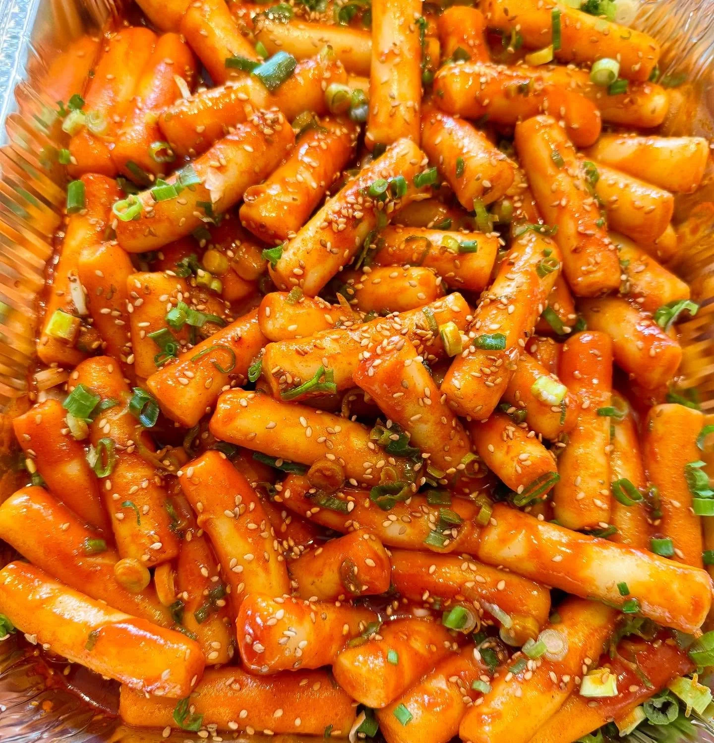 A close up of our Ddukbokki (rice cakes tossed in a spicy gochujang sauce) 😍 One bite of this soft, savory, sweet with a little heat and you’ll be hooked!