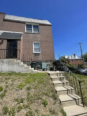 East Germantown Investor Special with Spacious Interiors and Renovation Potential