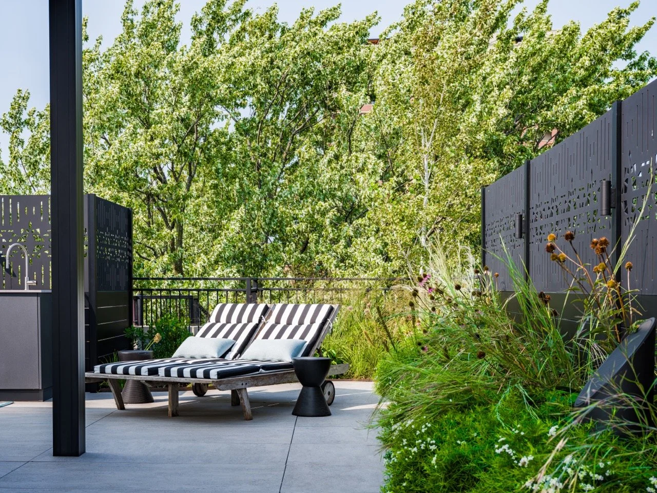 Rooftopia-wrigleyville-outdoor-rooftop-deck-lounge-planters-plants-screens.jpeg
