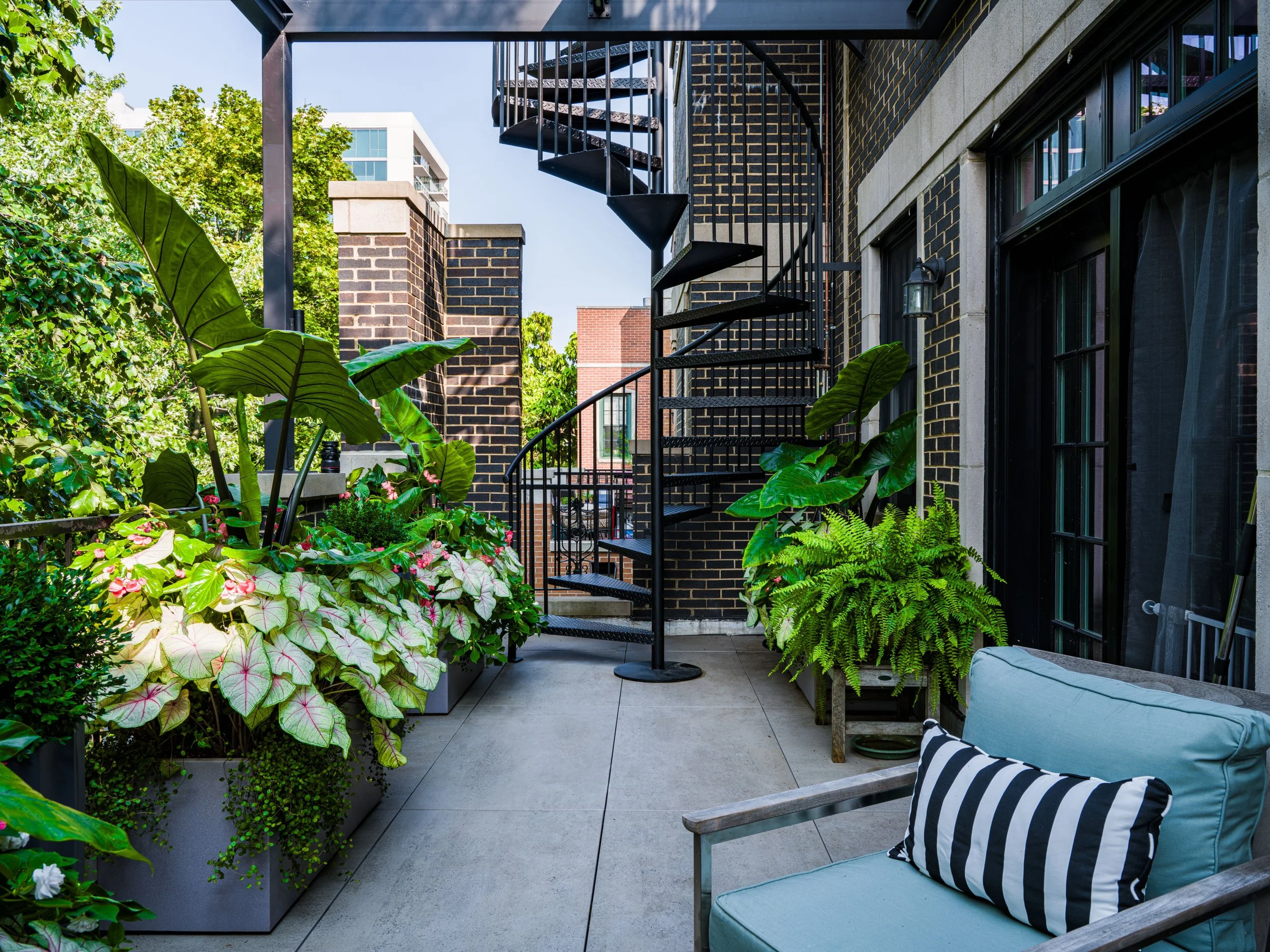 Wrigleyville deck with planters, staircase and outdoor furniture