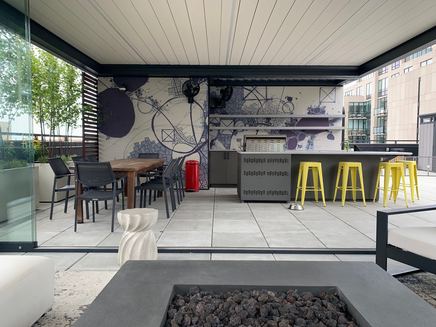 We had the incredible opportunity to collaborate with the talented @dereklerner on a stunning mural for our client's outdoor kitchen! With expert installation support from @chicagosignsystems, this artwork is now a permanent showstopper in the space 