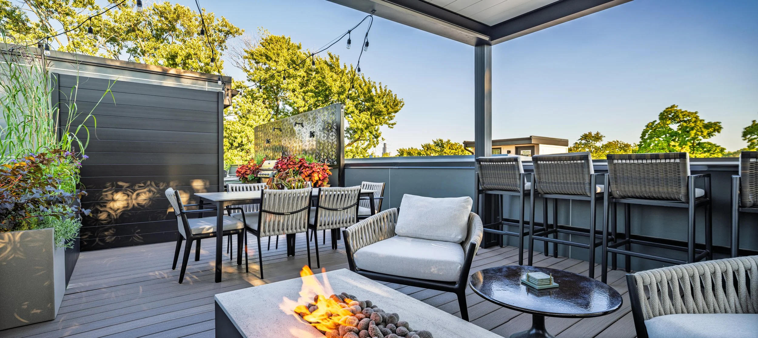 Rooftopia-rooftop-deck-pergola-custom-screens-firetable-seating.jpg