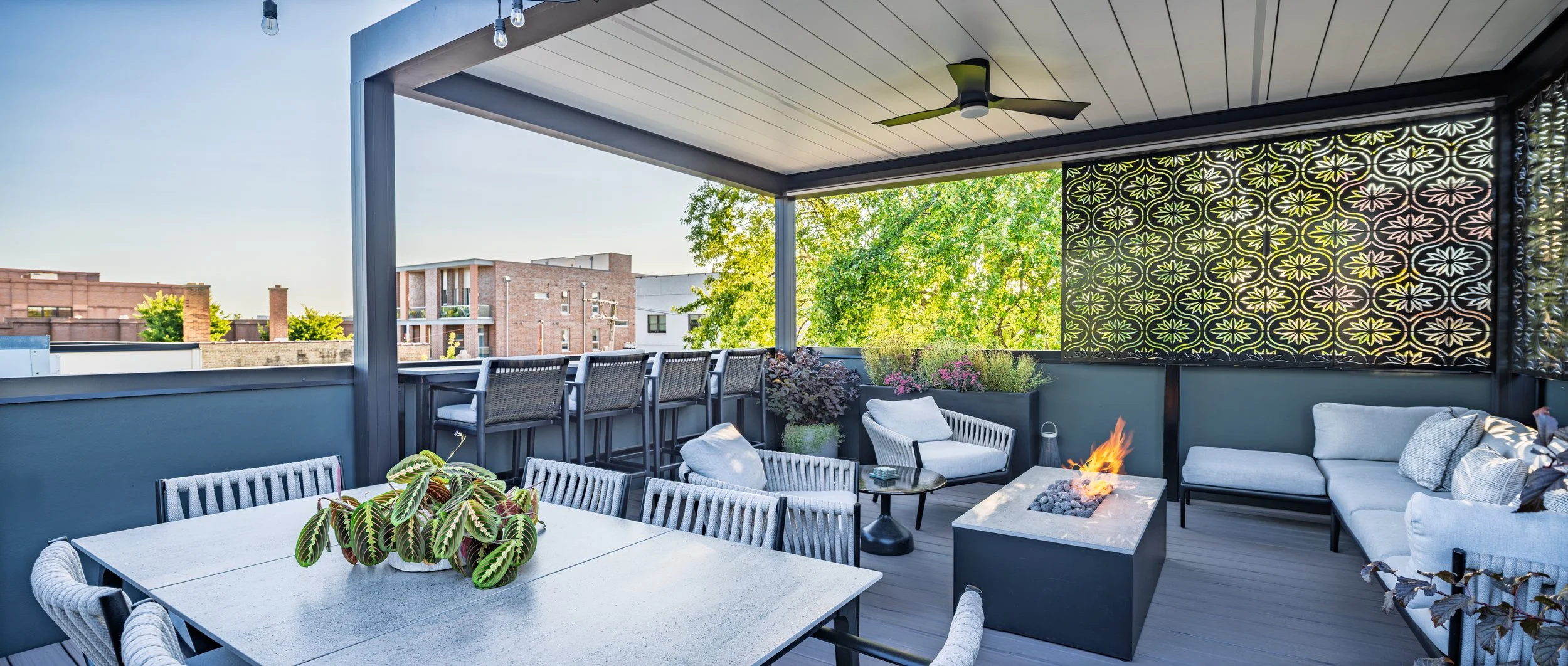 Rooftopia-rooftop-deck-pergola-custom-screens-firetable-seating.jpg