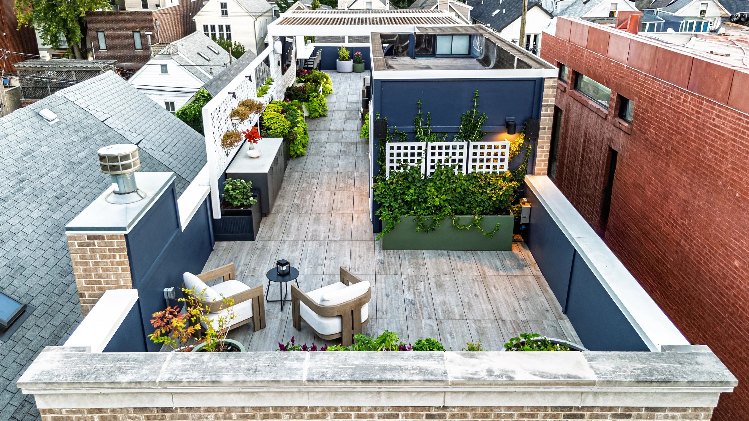 Rooftopia-full-view-rooftop-deck-sitting-pergola-planters-kitchen.jpg