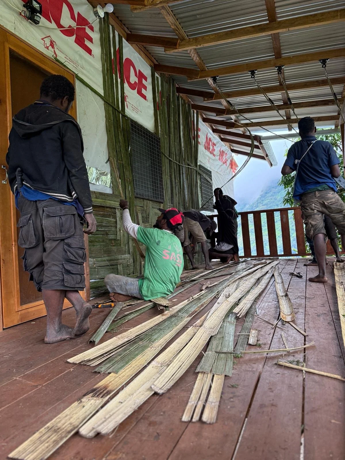 Weaving bamboo on Brendle's house