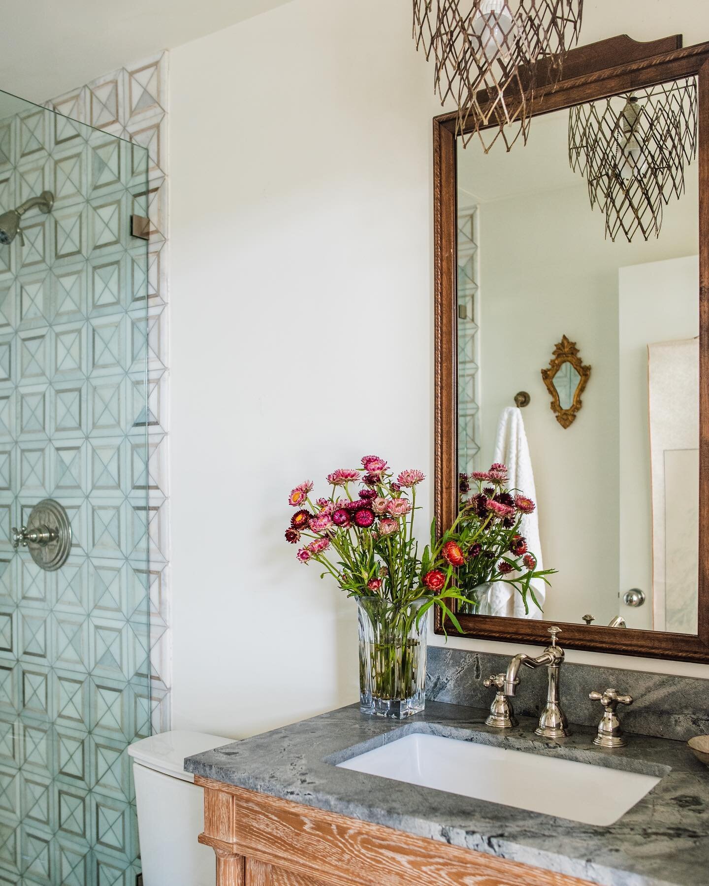 One of several #bathrooms we remodeled at #StanfordHouse. We kept it sweet and a bit rustic but included a jazzy statement tile for a punch. The pendant light was a vintage mystery something that we found while antique shopping in our hometown @kingr