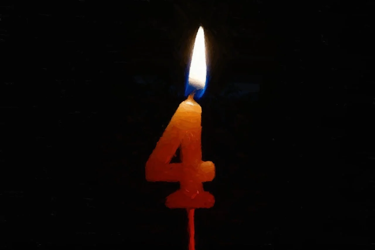 a lit “4” candle, representing the four expressive therapies in Austin, TX for the treatment of anxiety, attachment issues, burnout, depression, grief or loss issues, self-esteem issues, spirituality issues, and trauma