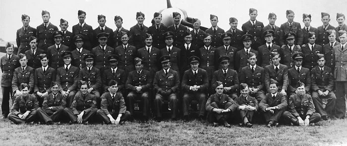 Pilots and instructors of Magee's spitfire course at No. 53 Operational Training Unit ar RAF Llandow in the summer of 1941. Magee is standing third from the left in the third row. Interestingly, the young sergeant pilot at the far right of the secon…