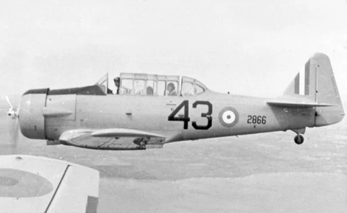 Of the 12 Harvards whose serial numbers are written in teenage John Magee’s logbook during his time at No. 2 Service Flying Training School (SFTS) at RCAF Station Uplands, only one, RCAF Serial 2866, surfaced in photographic form after our search for an aircraft which would inspire the markings of the High Flight Harvard. The photo, from aviation enthusiast Benno Goethals, was a perfectly posed image which, though poor in resolution, enabled us to accurately size and position the markings. It was the best we could hope for in a template for the project. Photo via Benno Goethals