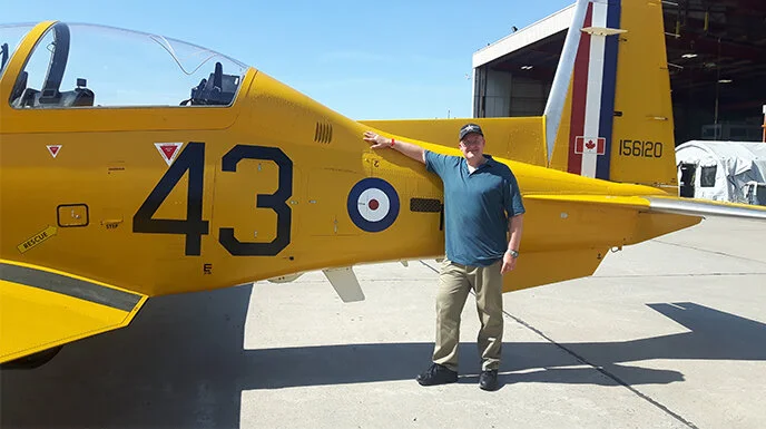 A week after the previous photo, and in considerably finer weather, the BCATP Harvard II was on static display at the Quinte International Air Show at 8 Wing, Canadian Forces Base Trenton. That is where transport pilot Rob Kostecka, the Polish Falcon and creator of the concept of the original High Flight Harvard, posed for a photo with the beautiful bird. Photo via Rob Kostecka