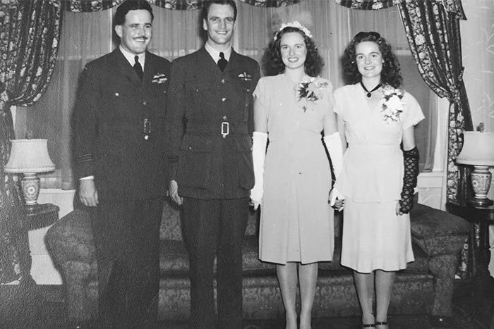 Mr. and Mrs John Carson Lee on the day of their wedding. John had been demobilized after his return to Canada but was still in uniform for their wedding day. Elizabeth, known as Betty to her friends, and John were both 23 years old. According to the Vancouver Sun's society pages, Betty wore a “Queen's blue crepe afternoon-length frock and chapel veil of matching blue held by a floral halo in matching tones,” while her bridesmaid, Miss Nora Moody, wore a “maize crepe tunic model.” Wing Commander F. K. Belton, RCAF chaplain, presided over the marriage. Lee's best man was none other than RCAF Spitfire pilot and double ace Squadron Leader Don “Chunky” Gordon, DFC and Bar, DFC (American), who shot down 12 enemy aircraft in the war. Lee would have known Gordon from their time at 83 Support Group Unit or possibly they met when Gordon was with 442 Squadron, 144 Wing in the same area of the Netherlands. According to Betty, now 97, Lee ran into Gordon in the streets of downtown Vancouver the week before they were to be wed and asked him to stand as his best man. Always up for an adventure with an old flying pal, Chunky happily agreed. Lee's formal RCAF portrait (in engagement notice above) shows a man of steely eye and square jaw, but here we see him as the man Betty married—an often funny and happy spirit who is clearly delighted with his new situation. Photo via Brian Irwin
