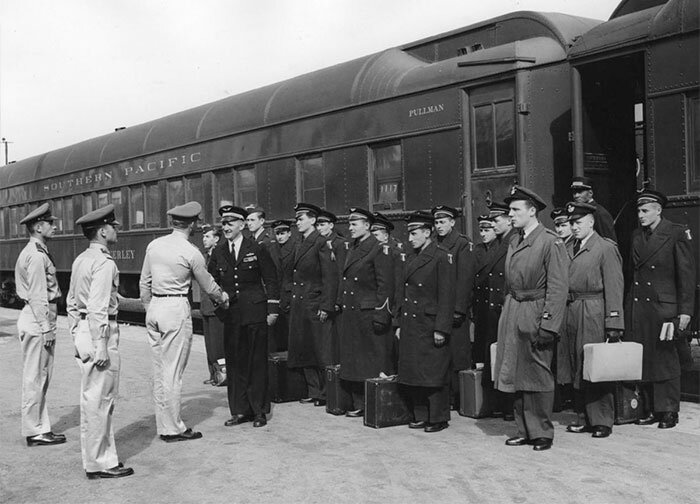 A train car–load of flight training cadets from Norway, Belgium, and France arrives in Tucson in 1951 and are greeted by officers from Marana. Photo via tucson.com