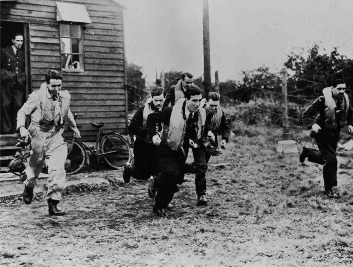 SCRAMBLE!!! Fighter pilots of the Royal Air Force grab their kit and run towards their aircraft. There are many evocative photographs taken in the summer of 1940 of young men like these, running to their possible deaths in the skies over England. During the Second World War, it is noted that, while fighting the Nazi onslaught, pilots&nbsp;wore shirt and tie. Many of these photos were staged for propaganda purposes, and if you look closely at any one of them, you are likely to find a pilot smirking sheepishly. Photo: Imperial War Museum