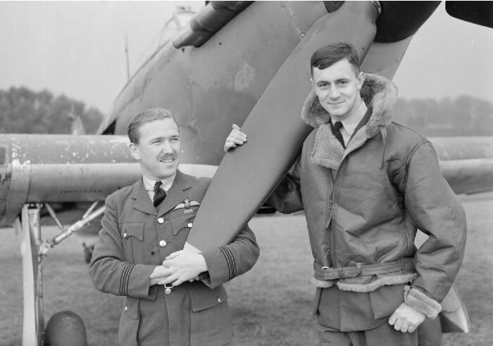 Flight Lieutenant Mark Henry “Hilly” Brown, DFC and Bar (left) was born in the tiny farming town of Glenboro, Manitoba in 1911. Given the flat prairie landscape of his hometown, it’s a wonder where he got his nickname. He received his wings from the Royal Air Force in 1938, and following actions in both the Battle of France and the Battle of Britain, he became the first Canadian ace of the Second World War. By the time of his death in November 1941 while&nbsp;on a fighter sweep from Malta, he had achieved Triple Ace status. The citation accompanying the award of his first Distinguished Flying Cross reads:&nbsp;“Since the beginning of the war Flight Lieutenant Brown has destroyed at least sixteen enemy aircraft. On 14th&nbsp;June, when leading his flight on patrol, he encountered nine enemy bombers, two of which were destroyed. Later he attacked nine Messerschmitt 109s, destroying one and driving the remainder off. As a result of bullets entering his aircraft he force landed near Caen, and was unable to rejoin the squadron before it withdrew from France. Flight Lieutenant Brown has shown courage of the highest order, and has led many flights with great success and determination when consistently outnumbered by enemy aircraft.”&nbsp;The citation for his second DFC reads&nbsp;“This officer has commanded the squadron with outstanding success. He has destroyed a further two enemy aircraft bringing his total victories to at least 18. His splendid leadership and dauntless spirit have been largely instrumental in maintaining a high standard of efficiency throughout the squadron”.&nbsp;The pilot next to him in this photo is named Pilot Officer Chatham. The photo was taken at RAF Huntingdonshire. Photo: Imperial War Museum