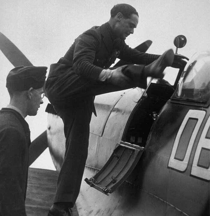 Group Captain Douglas Bader heaves an artificial leg into the cockpit of a Supermarine Spitfire. This was after the end of the Second World War, as Bader was promoted to that rank in 1946. Photo: RAF