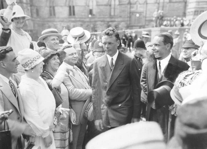 Lindbergh, looking far less happy than he should be, is squired through adoring crowds on Parliament Hill by American Ambassador William Phillips. Photo via Canada Aviation and Space Museum