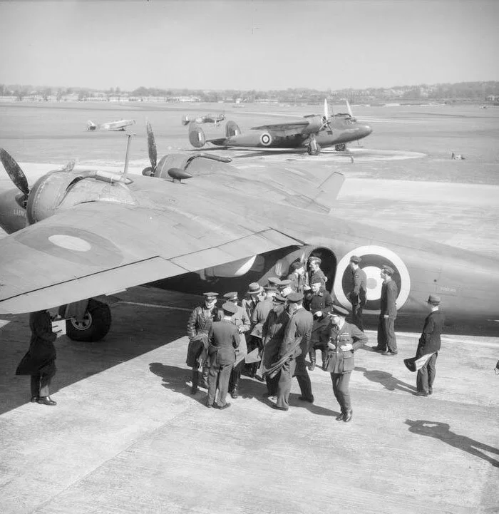 De Havilland Flamingos of No. 24 Squadron RAF at Hendon, Middlesex. In the foreground, an advance party of Russian officials disembarks from R2765 Lady of Hendon to be greeted by senior RAF officers and representatives of the Foreign Office, having been flown from Prestwick in order to prepare for the forthcoming visit to London by the People’s Commissar for Foreign Affairs, V.M. Molotov. Parked in the background is R2764 Lady of Castledown, which perished the following day while undertaking a similar mission from Prestwick to Hendon. The aircraft caught fire and crashed near Great Ouseburn, Yorkshire, killing the crew and all six members of the Russian party on board. Although suspicions of sabotage were voiced at the time, it appears that a cylinder head in one of the engines broke away accidentally in mid-air, causing an engine fire and the loss of one of the wings. Photo and text via Imperial War Museum