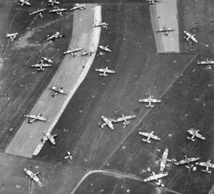 The morning after Operation MALLARD in which Trevor Southgate participated along with his Dakota crew and others of 512 Squadron, is depicted in this oblique photographic-reconnaissance vertical, taken from 800 feet, showing part of Landing Zone ‘N’, north of Ranville, Normandy, on the day following the airborne landing of the 6th Airlanding Brigade and the Airborne Armoured Reconnaissance Regiment in the evening of 6 June 1944. Likely, one of these Horsa gliders is the result of Southgate’s handiwork. Photo: Imperial War Museum