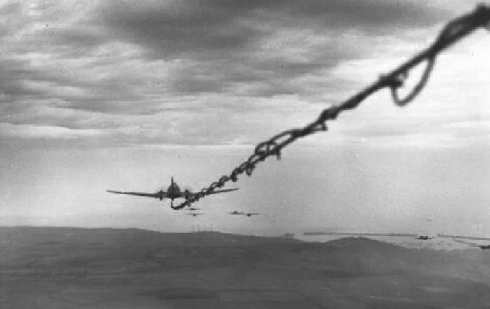 The view from a glider pilot’s perspective of a Dakota towing his glider towards the North Sea en route to Holland and Operation MARKET GARDEN. The coiled wire is a telephone line direct to the tow plane. Photo: GlideToGlory.com