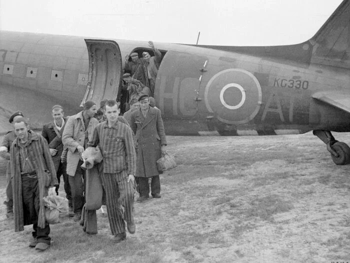 512 Squadron Dakota Mk III, HC-AT (RAF Serial No. KG330), lands at the Brussels Airport to repatriate Belgian nationals from Germany—both slave labourers and former concentration camp inmates. This 512 Squadron aircraft brought in the infantry and a…