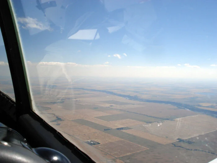 Flying east out of Alberta we find ourselves over Southern Saskatchewan, where we come upon the long westernmost tendril of Lake Diefenbaker to our right. This part of the lake is more like a river and cuts eastward for almost two hundred kilometers. Seeing geography from this perspective is one of the finest attributes of flight. Photo: Dave O'Malley