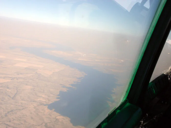 We cut across Lake Diefenbaker. Moose Jaw lies now to the southeast about 85 kilometers away. One of the largest geographical features on the Saskatchewan prairie is Lake Diefenbaker, named for a Saskatchewan firebrand politician and Canada's 13th Prime Minister, John George Diefenbaker. Lake Diefenbaker, a reservoir and bifurcation lake, was formed by the construction of Gardiner Dam and the Qu'Appelle River Dam across the South Saskatchewan and Qu'Appelle Rivers respectively. Construction began in 1959 and the lake was filled in 1967. The lake is 225 kilometres long with approximately 800 kilometers of shoreline. Lake Diefenbaker provides water for domestic irrigation and town water supplies. Photo: Dave O'Malley