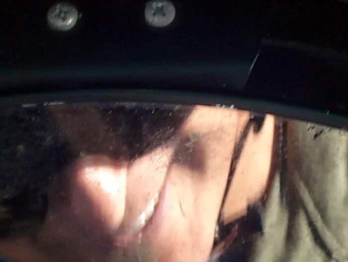 The 60 knot tailwind grin. Perfect flying conditions will bring a smile to any aviator's face. Zooming into Bruce's rear view mirror, I catch a glimpse of his ever present smile even wider than normal. Photo: Dave O'Malley