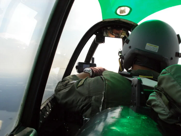 The “Professor” conducts his classes from the front of his T-28, while his student throws question after question at him from the back seat – a far better student-teacher ratio than I was used to in university where classes of three hundred students listened to a prof drone far below in a theatre of mediocrity. Photo: Dave O'Malley