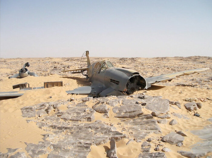 Copping's wrecked P-40 still sits in the Egyptian desert. Other than the 70 years of scouring by the sand and the recent ravages of vandals, it is exactly as Copping would have seen it when he turned one last time to look back at the aircraft he was…