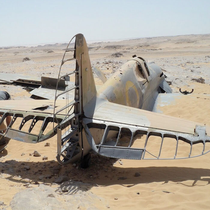 The dry desert air has preserved all the metal parts of Copping's Kittyhawk, but all the fabric which covered the tail feathers has now disappeared–dried, cracked and blown away by seventy years of hot desert winds and freezing nights. The water sol…