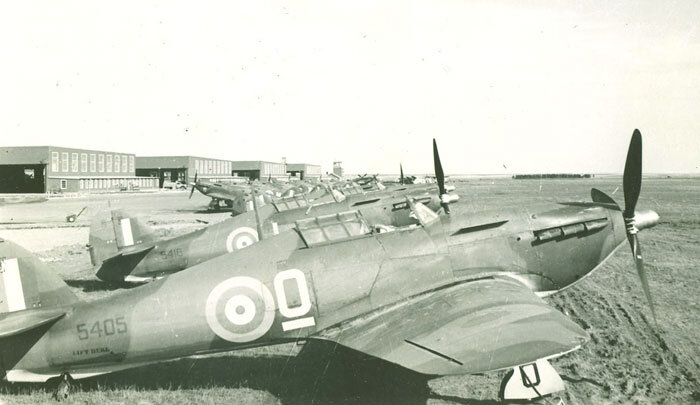 Newly arrived and marked Hawker Hurricane Mk XIIs warm in the sun at Mossbank, Saskatchewan in 1942. The Hurricane (RCAF serial 5405) in the foreground is the same as the one shown in the colour photo in the opening title image of this story. Delive…