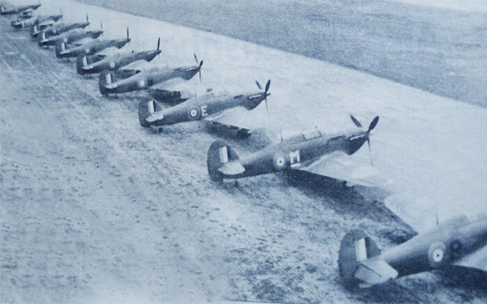 Another photo from a local paper shows 135s arrival at Patricia Bay from Terrace, British Columbia via Sea Island, shows the flight line crowded with different Hurricanes which they picked up in Sea Island, lined wing tip to wing tip. The image was …