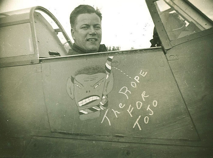There was no holding back when it came to racist images of the Japanese, even for Canadian fighter pilots. Here a 135 Squadron Hurricane, flown by “Pop” Battleson sports artwork depicting a Red, White and Blue rope hanging a highly egregious image of General Hideki Tojo, Japan's War Minister, replete with slanted eyes, pointed ears and buck teeth. Judging by the pine trees in the background, and the graphic clear reference to fighting the Japanese, this image most likely was taken on the West Coast - Pat Bay, Terrace or Annette Island. Photo from G. Lawson Collection via Atlantic Aviation Museum
