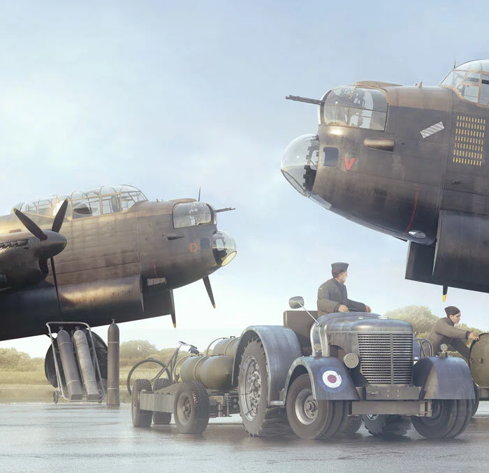 Forkasiewicz carefully composes his scene with digitally modelled equipment typical of a bombing up scenario—bomb trolleys, tugs, oxygen cylinders all combine with a wet English landscape to set the scene. Note the purple and white striped Distingui…