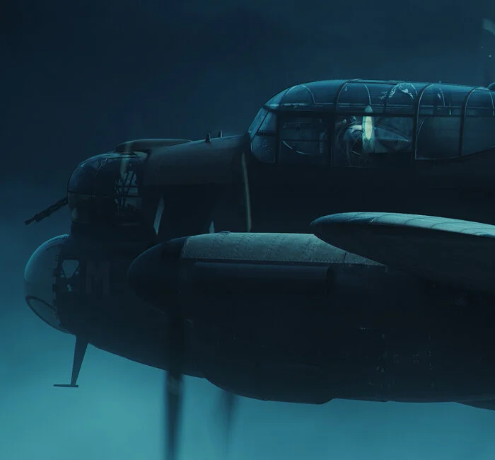So young. Many young airmen, like Canadian Jimmy Rheubottom, lied about their age to become airmen and test their metal in combat. At the time of his death, Rheubottom, the mid-upper gunner, was just 17. He could not have been older than 16 when he enlisted in the RCAF. Here we see cannon fire from the night fighter striking Rheubottom in his turret and raking the starboard side of the Lancaster. Detail from Into the Darkness by Piotr Forkasiewicz