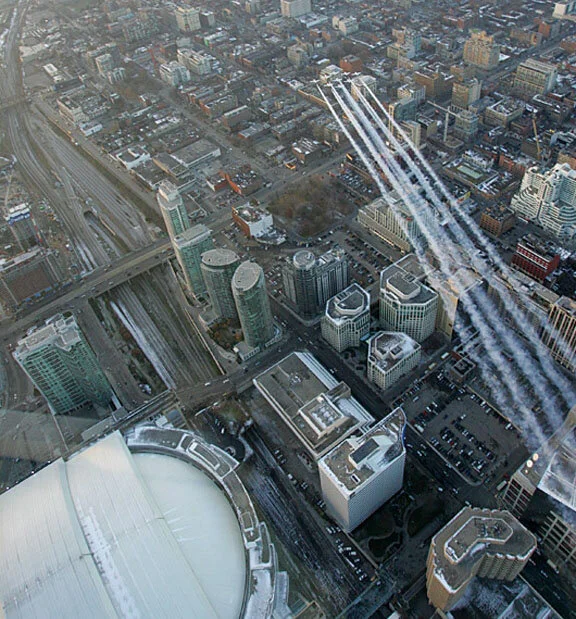 The Snowbirds sweep across the city and head for the airport. The team can now enjoy the game, but Lead Mitchell has one more task to perform. Photo Ken Lin
