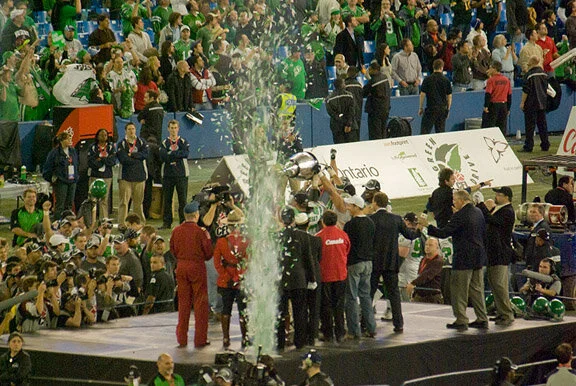 Rob Mitchell stands on the podium as the Cup is raised by the team captain. Jolted by the confetti cannons exploding behind him, it was then, and only then, that he thought perhaps this wasn’t a good idea. Photo by sjgardiner at flickr.com