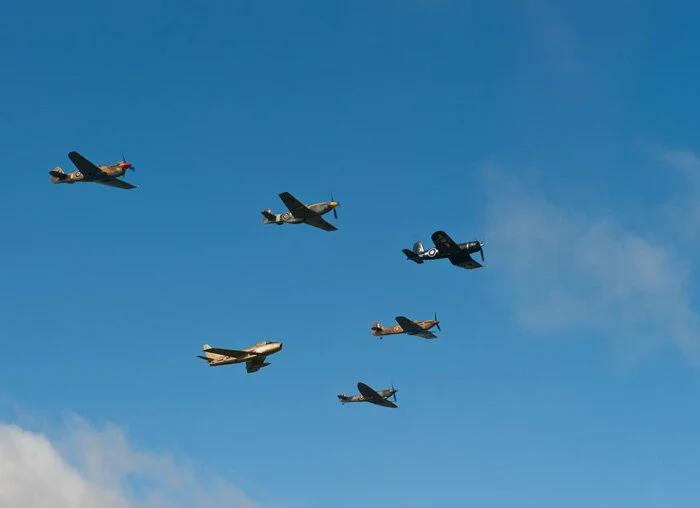Doug Fleck sweeps the RV-8 across and beneath the formation. Photo: Peter Handley