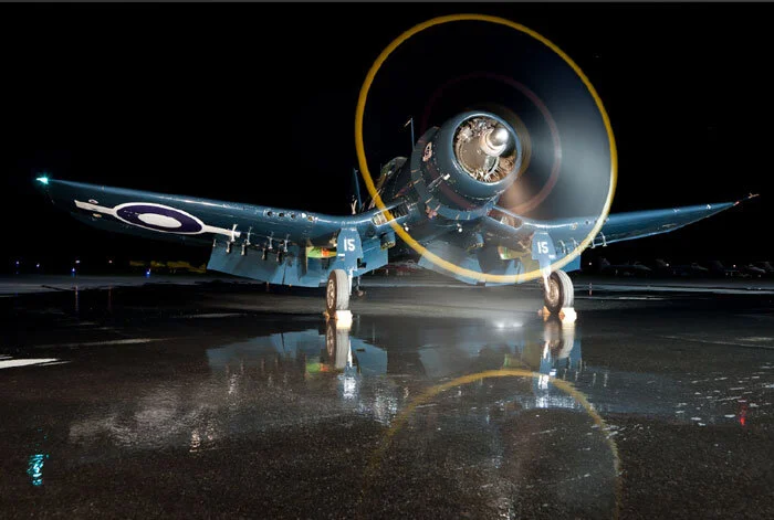 “Why water the ramp?” one might ask. Within seconds, the drama of reflection was obvious. Note the vortex of water leaping from the tarmac at the very bottom of the prop's arc. Photo: Richard Mallory Allnutt.